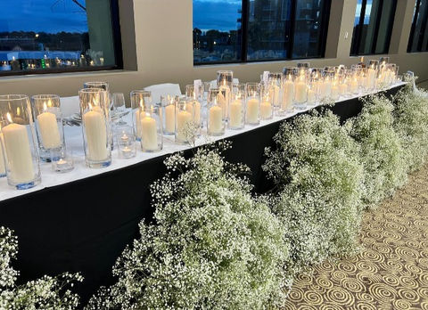 Baby's breath and candles bridal table