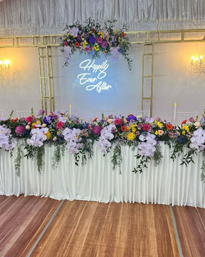 Neon sign with chandeliers and truss arch