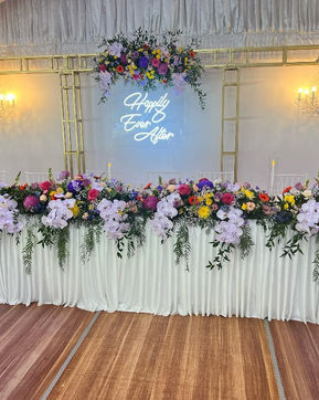 Neon sign with chandeliers and truss arch